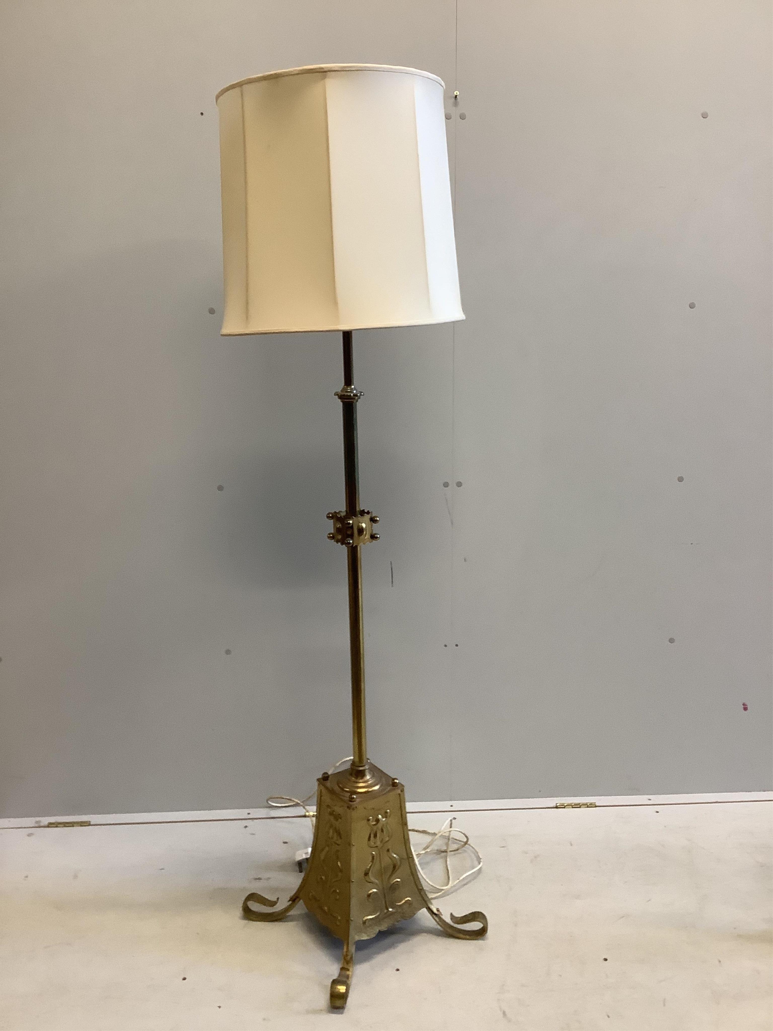 An early 20th century Arts and Crafts brass telescopic standard lamp. Condition - fair